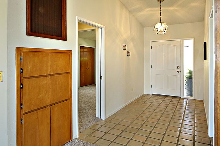 Foyer with spanish paver style tiles