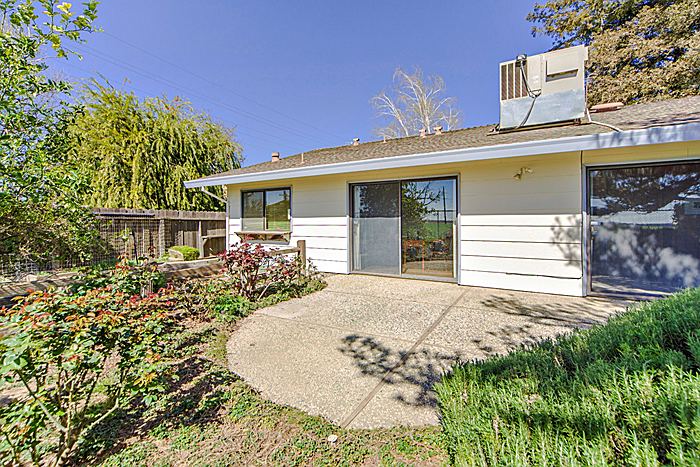 Backyard with patio and garden beds