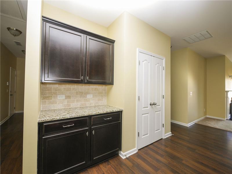 Laundry room near kitchen with washer and dryer