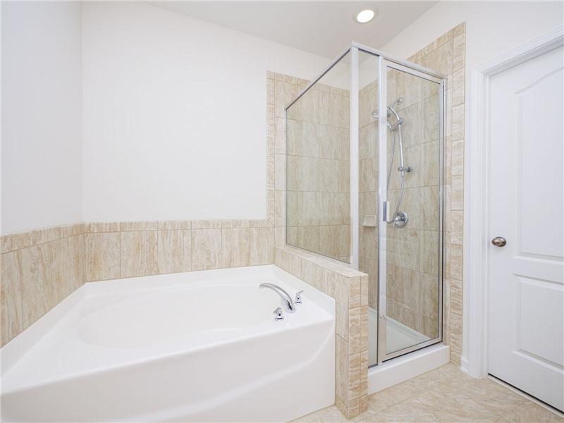 Tile surround, shower and floor in master bath
