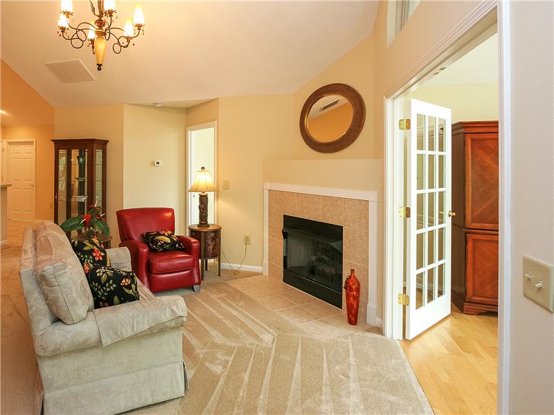 Gas log fireplace with tile surround and hearth