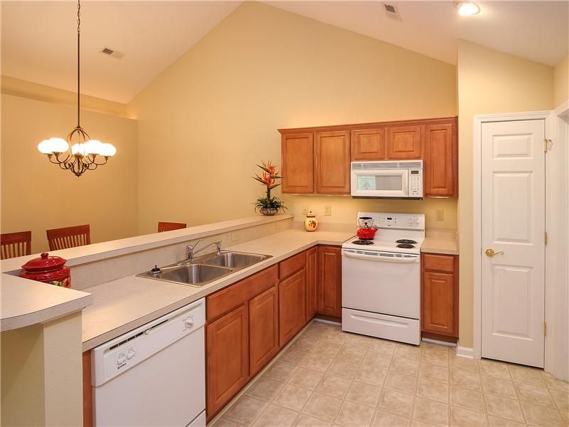 Abundant maple cabinetry plus pantry