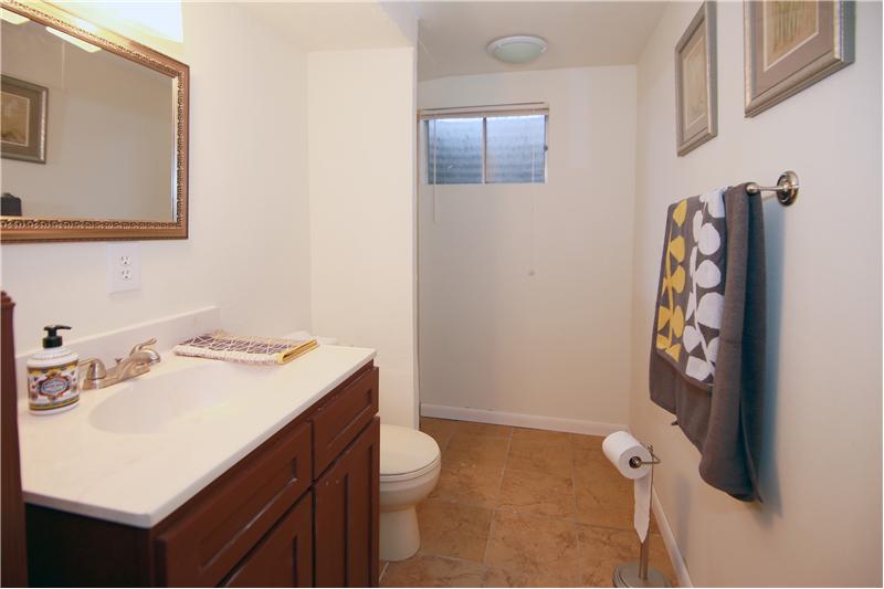 Updated basement 3/4 bath with tile