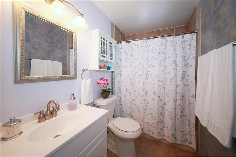 Beautifully updated main level bathroom with tile!
