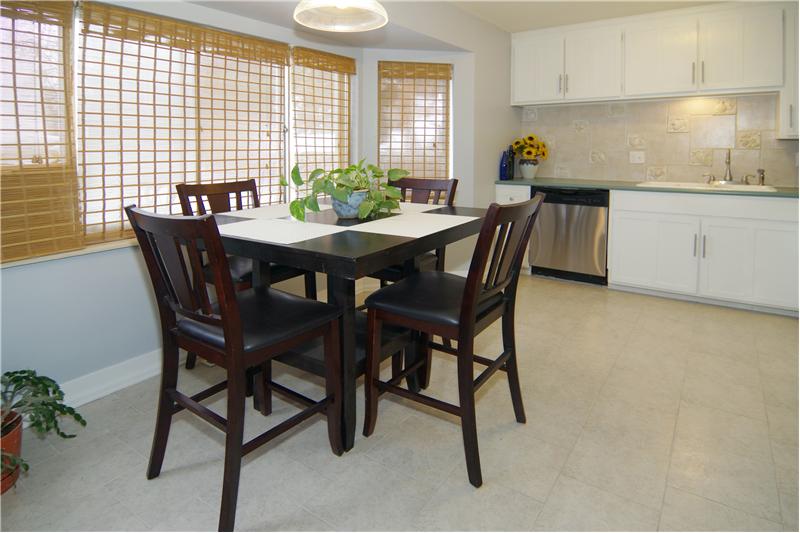 Eat-in kitchen with tile flooring