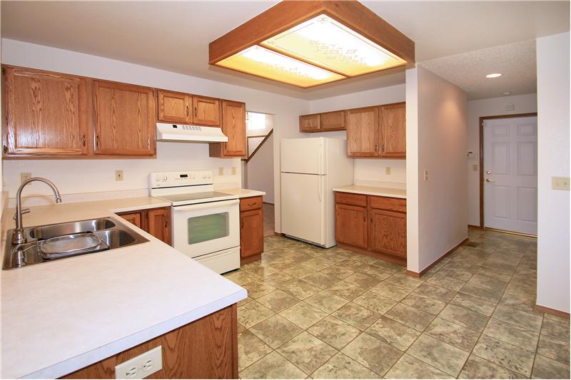 Kitchen with breakfast bar, new dishwasher, new sink and faucet, smooth top range
