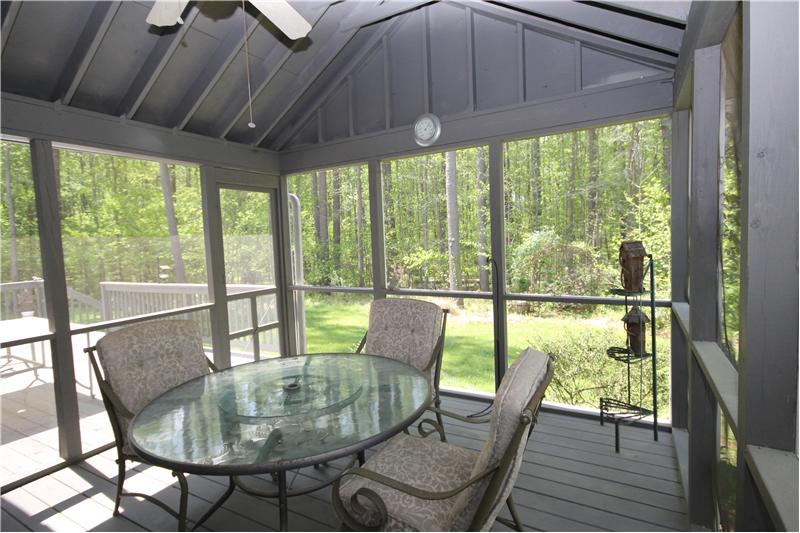 Spend quite evenings on the large screened porch surrounded with a view of the woods