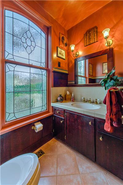 Downstairs Full Bath off the Library with Stained Glass Window