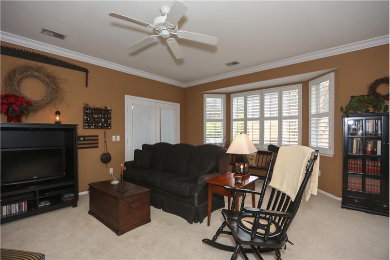 Spacious open floor plan.  The living room has wonderful views with gorgeous crown molding and plantation shutters