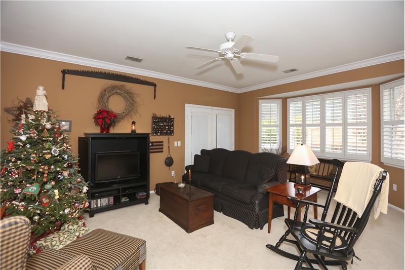 Living room with double door entry to garden room/porch
