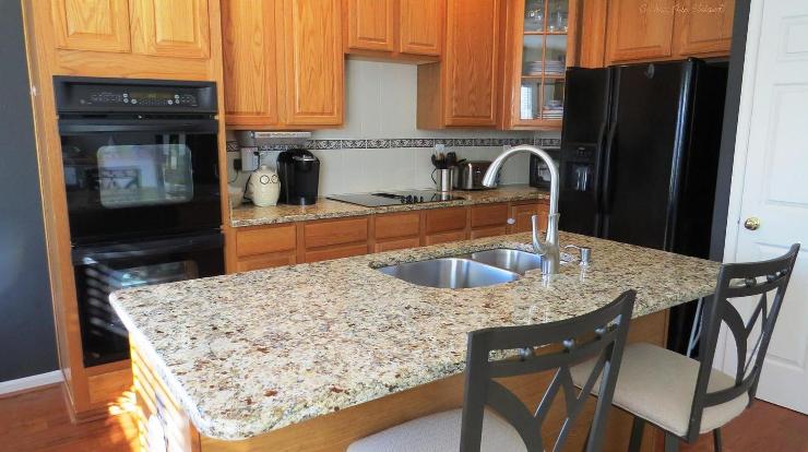 Kitchen has Granite Counters & Hardwood Floors