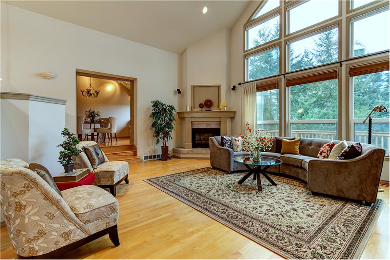 Soaring Ceilings in the Huge Living Room with Lots of Natural Light.