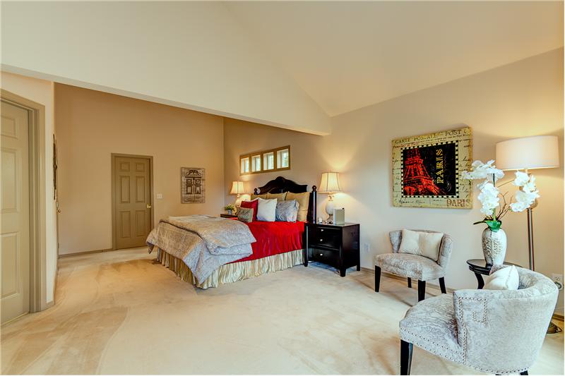 Another View of the Large Master Bedroom with Vaulted Ceilings and Loads of Natural Light.