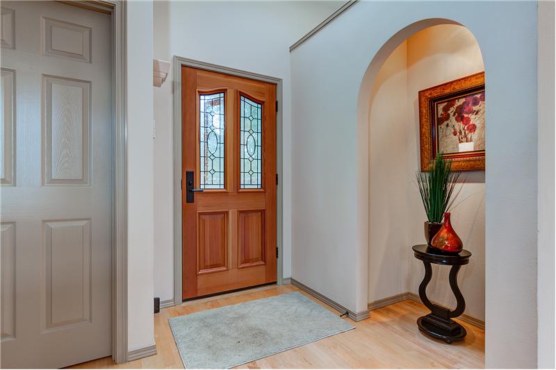 Inviting Entry with an Alcove and Gleaming Hardwood Floors.