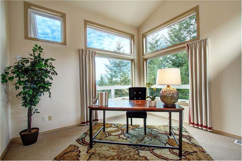 Amazing Views of the Olympics and Henderson Bay from the Den with Vaulted Ceilings and Loads of Natural Light.