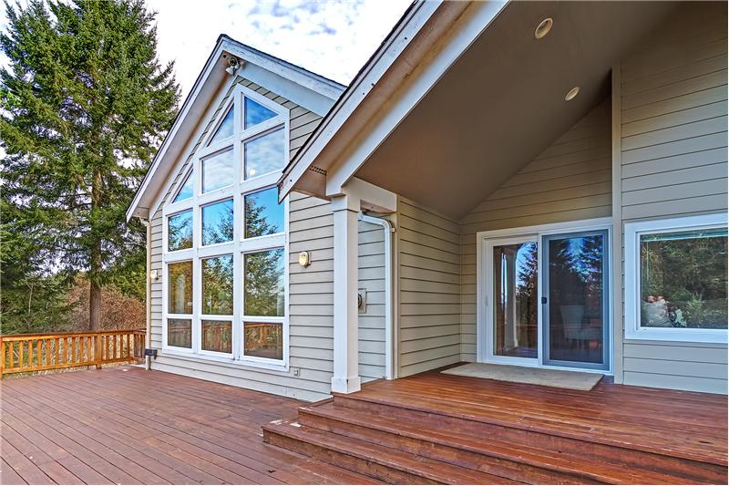 Portion of the Covered Deck off of the Formal Dining Room with French Double Doors. BBQ all year round.