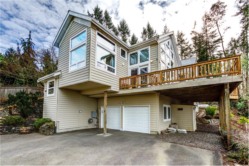 Attached Two Car Garage, Generator and AC Unit.