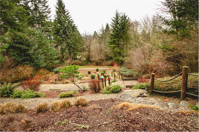 Terraced Backyard with Horse Shoe Pit and Sand Court.